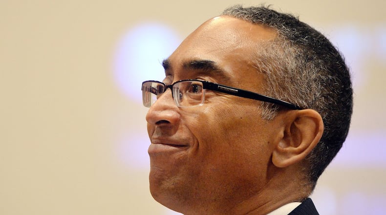DeKalb County CEO Burrell Ellis smiles as the jury enters the courtroom June 18, 2015. The jury later found Ellis guilty of attempted extortion and perjury, but the Georgia Supreme Court threw out the verdict Wednesday. KENT D. JOHNSON /KDJOHNSON@AJC.COM