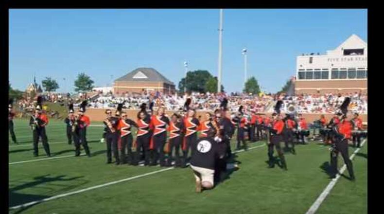 A Mercer band major from Marietta was surprised by her Alpharetta boyfriend's proposal at halftime on the football field.