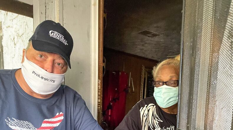 Meals On Wheels Atlanta volunteer George Messner delivers food to a recipient.