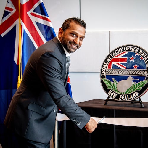 FILE - In this photo released by the U.S. Embassy in Wellington, New Zealand, FBI Director Kash Patel cuts the ribbon at the official opening of the FBI office in Wellington, New Zealand, July 31, 2025. (Ola Thorsen/U.S. Embassy via AP, File)
