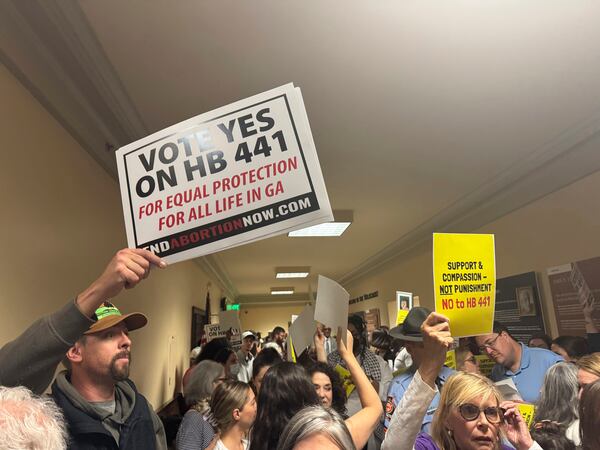 Protestors gather for a hearing on a bill that would ban all abortion at the Capitol on Wednesday, March 26, 2025, in Atlanta, Ga. (AP Photo/Charlotte Kramon)