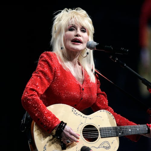 FILE - Dolly Parton performs at a United Way of America convention in Detroit, Friday, May 15, 2009. (AP Photo/Carlos Osorio, File)
