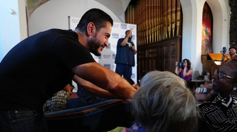 Abdul El-Sayed, a progressive candidate in the Democratic primary for U.S. Senate in Michigan, greets people at a campaign rally, Monday, Aug. 3, 2026, in Detroit. (AP Photo/Julia Demaree Nikhinson)