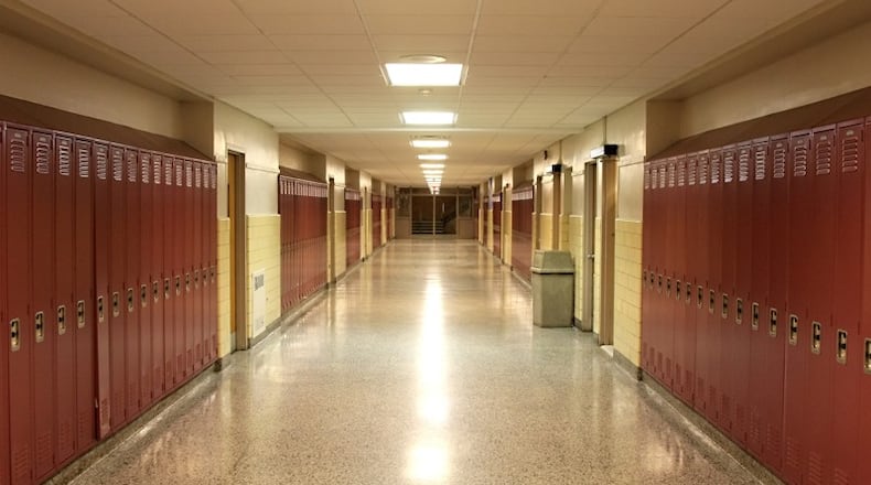 The teacher resigned during the investigation, and the principal was placed on paid administrative leave.