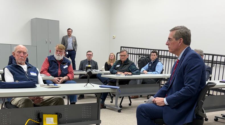 Jay McMaster, a 93-year-old retiree, is among the jilted First Liberty investors at a round table with Secretary of State Brad Raffensperger. (Greg Bluestein/AJC)