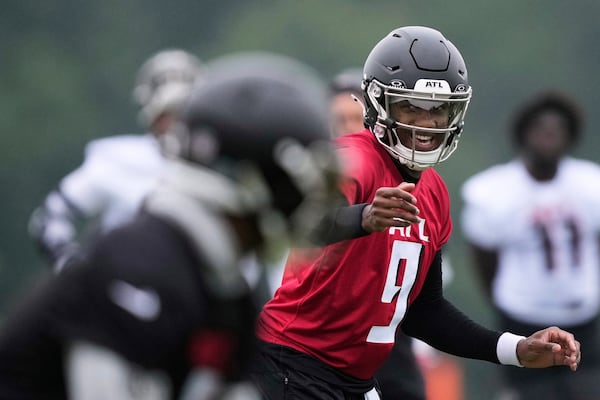 Atlanta Falcons quarterback Michael Penix Jr. (9) runs drills during an NFL football training camp practice on Tuesday, May 27, 2025, in Flowery Branch, Ga. (AP Photo/Brynn Anderson)
