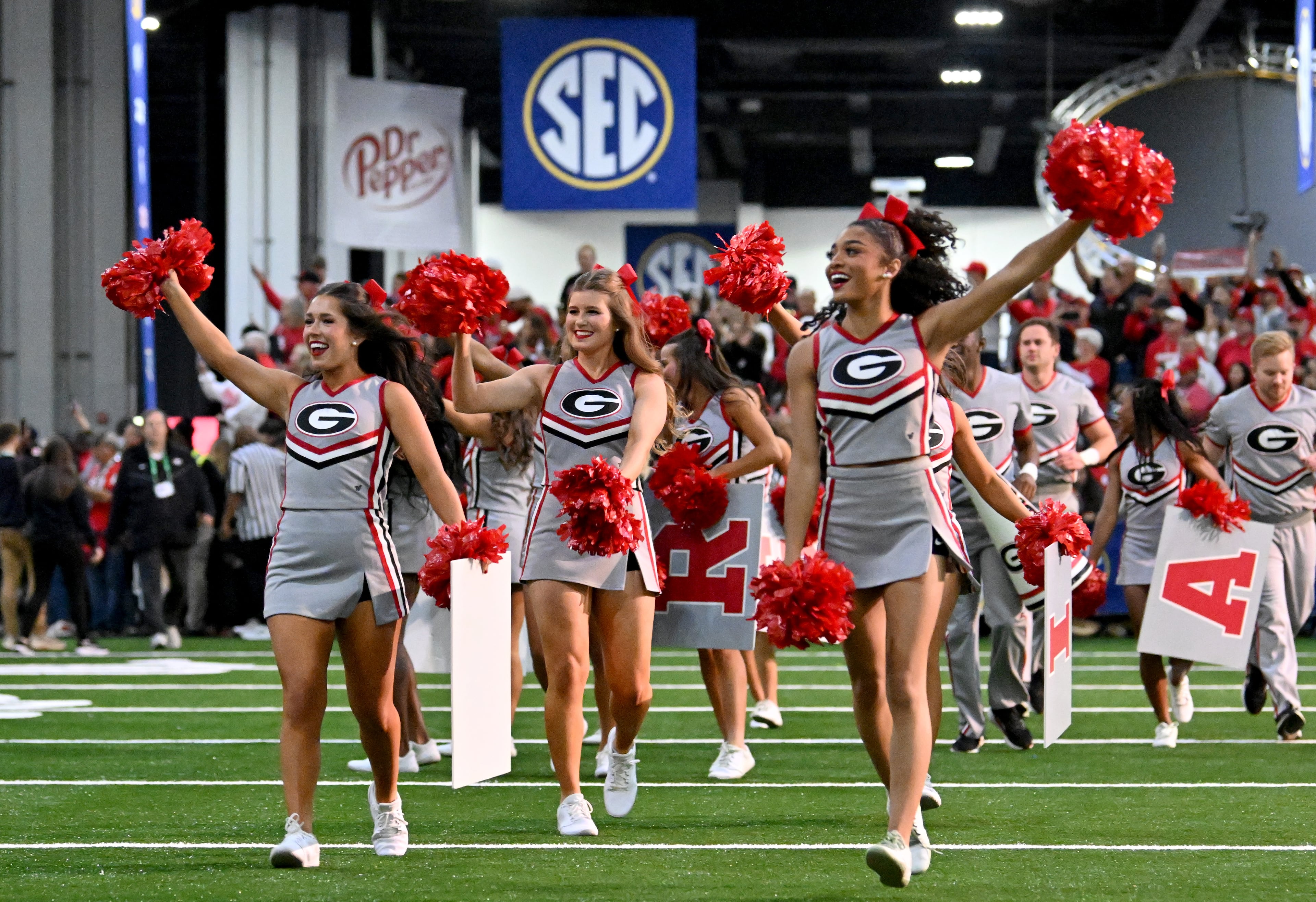 Members of Georgia’s Spirit Squad enter during pep rallies at The Dr Pepper SEC FanFare ahead of the SEC Championship football game between Georgia and Alabama, Saturday, Dec. 6, 2025 in Atlanta. (Hyosub Shin/AJC)