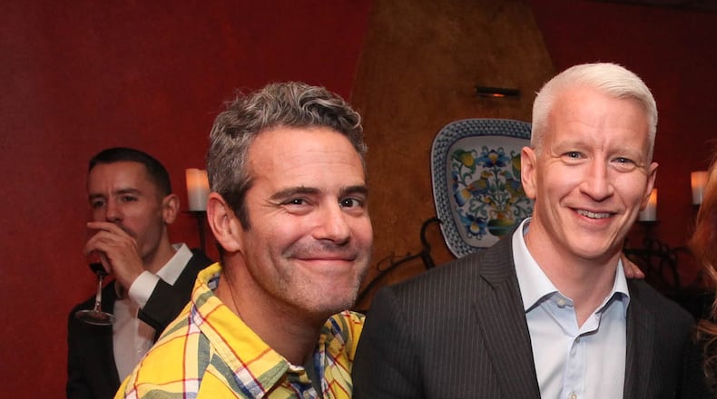 NEW YORK, NY - NOVEMBER 08: (EXCLUSIVE COVERAGE) (L-R) Andy Cohen, Anderson Cooper, Kathy Griffin and Gloria Steinem attend Kathy Griffin's Carnegie Hall Performance official after party hosted by Anderson Cooper at Trattoria Dell Arte Restaurant on November 8, 2013 in New York City. (Photo by Rob Kim/Getty Images) Andy Cohen and Anderson Cooper have known each other for many years and will be kibitzing at Cobb Energy Centre June 13. CREDIT: Getty Images