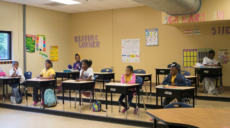 Students in Genesis Innovation Academy’s Girls School participate during class on May 11, 2018. ALYSSA POINTER/ALYSSA.POINTER@AJC.COM