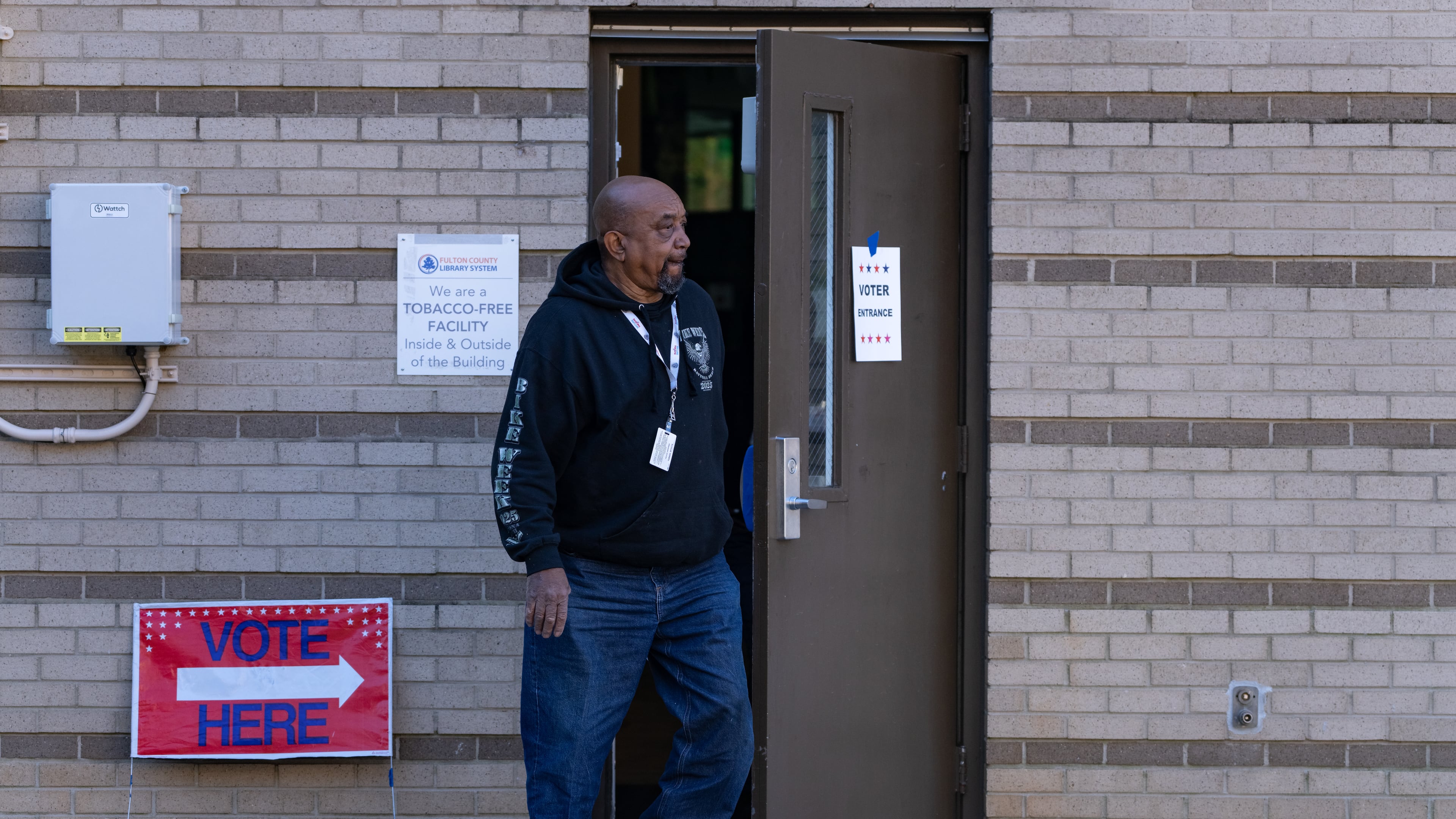 A man leaves the voting precinct at the Joan P. Garner Library at Ponce De Leon Avenue NE in Atlanta on Monday, November 4, 2025. (Ben Hendren for the AJC)