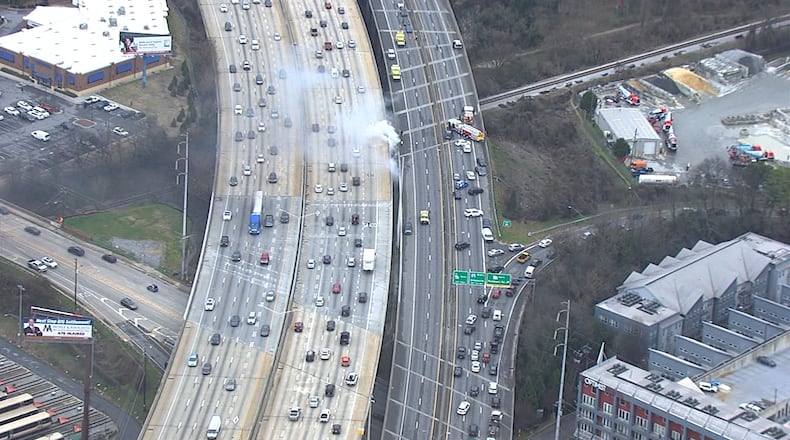 White smoke was seen pouring from beneath I-85 near Piedmont Road on Thursday.