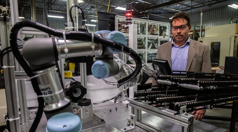 Brian Pelke, president of Kay Manufacturing, an automotive parts company in Calumet City, Ill., looks at their newest Universal Robot on Wednesday, Sept. 12, 2018. The manufacturing company has been incorporating collaborative robots, widely known as cobots, into its production process. The Universal Robots are used mostly for end-of-line tasks, packaging and palletizing parts off a conveyor. (Zbigniew Bzdak/Chicago Tribune/TNS)