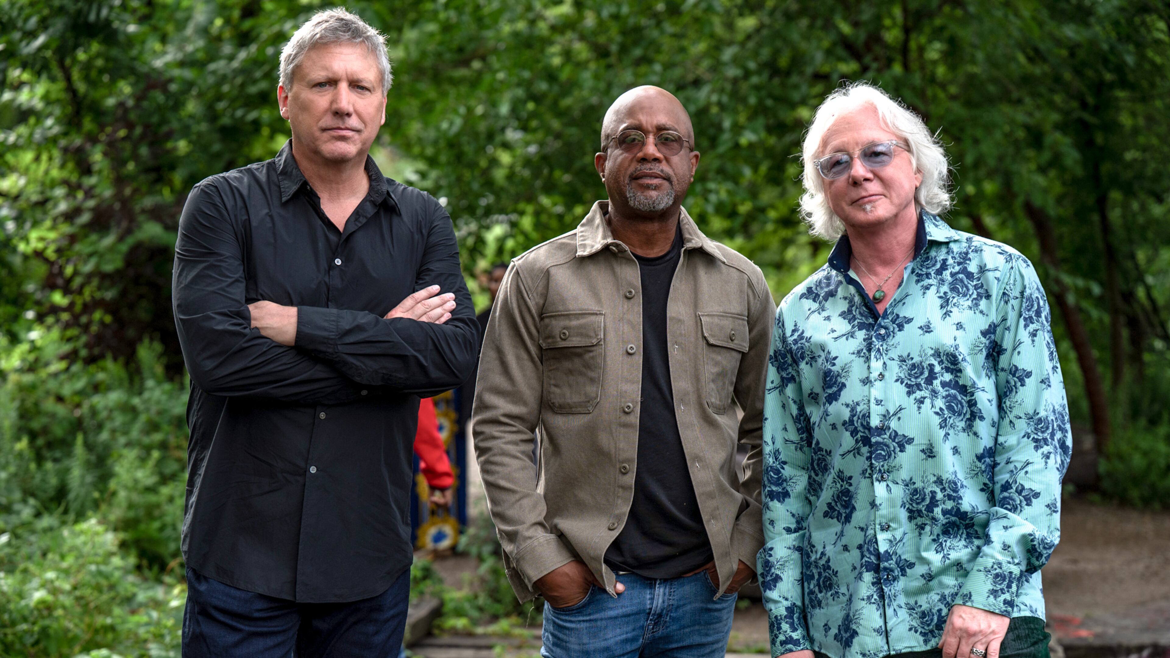 R.E.M.'s Mike Mills (right) says of Howl Owl Howl, the new band with friends (from left) Steve Gorman of the Black Crowes and Darius Rucker of Hootie and the Blowfish, "I believe the crowd expects us to be good, even though they may not know exactly what they’re gonna get before they hear it." (Courtesy of Steven Cohen Photo)