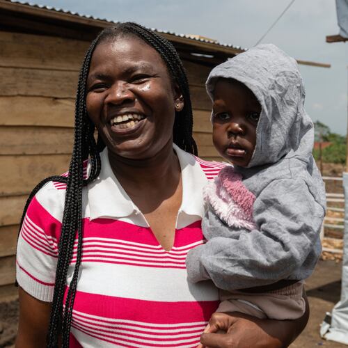 Kahindo Mireille Pierrette, an Ebola survivor poses with her 16-month old baby, after they were declared to have survived Ebola and discharged from the Rwampara treament Center in Ituri Congo, Tuesday, June 16, 2026. (AP Photo/Moses Sawasawa)