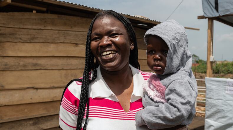 Kahindo Mireille Pierrette, an Ebola survivor poses with her 16-month old baby, after they were declared to have survived Ebola and discharged from the Rwampara treament Center in Ituri Congo, Tuesday, June 16, 2026. (AP Photo/Moses Sawasawa)