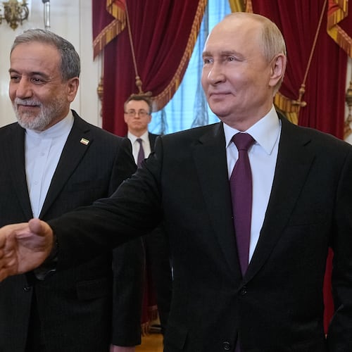 Russian President Vladimir Putin, right, and Iranian Foreign Minister Abbas Araghchi walk to attend the talks at the Boris Yeltsin Presidential Library, in St. Petersburg, Russia, Monday, April 27, 2026. (AP Photo/Dmitri Lovetsky, Pool)