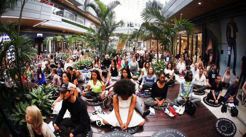 Hundreds gathered earlier this year for a group meditation at Brickell City Centre to celebrate Earth Day. Interest in meditation has increased in light of scientific research that supports claims of its healthy benefits. CONTRIBUTED BY Roberto Koltun/Miami Herald/TNS