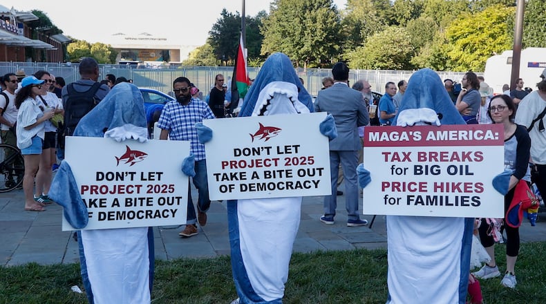 People dressed in shark costumes protest Project 2025 across from the National Constitution Center before the presidential debate in Philadelphia, Tuesday, Sept. 10, 2024. (Steven M. Falk/The Philadelphia Inquirer/TNS)