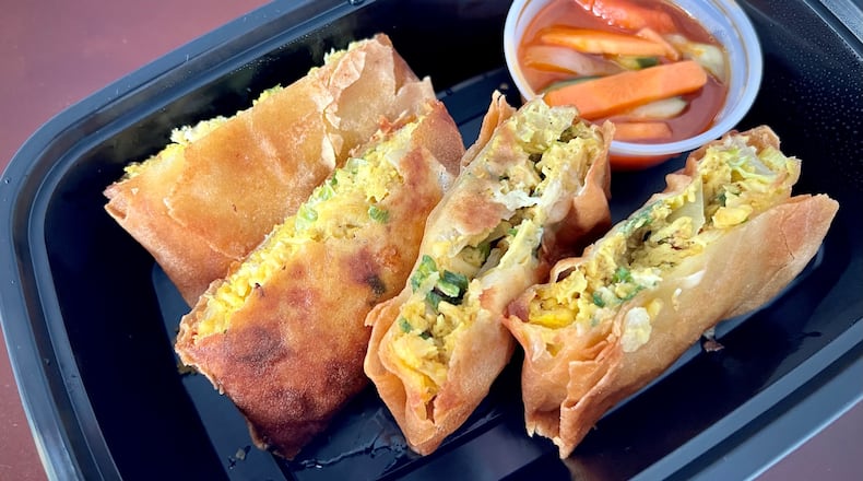 Win Gastrobar in Buckhead serves chicken and egg pillows, a form of the common Indonesian street food martabak. Henri Hollis/henri.hollis@ajc.com