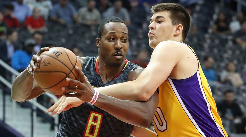 November 2, 2016, ATLANTA: Hawks Dwight Howard drives against Lakers Ivica Zubac during the first period in an NBA basketball game at Philips Arena on Wednesday, Nov. 2, 2016, in Atlanta. Curtis Compton /ccompton@ajc.com