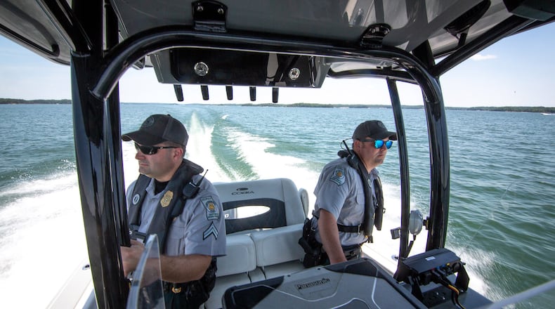 Game wardens Dan Schay (left) and Kevin Goss patrol Lake Lanier. A 20-year-old drowned there over the weekend while swimming at the Margaritaville water park.