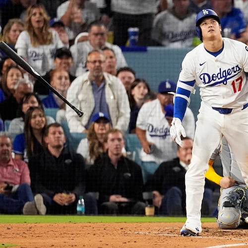 Los Angeles Dodgers' Shohei Ohtani watches his home run against the Milwaukee Brewers during the fourth inning in Game 4 of baseball's National League Championship Series, Friday, Oct. 17, 2025, in Los Angeles. (AP Photo/Mark J. Terrill)