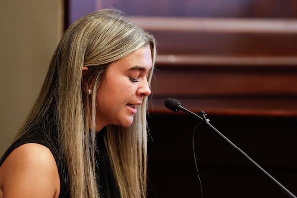 Braelyn Pierce, 16, the sister of Adalynn “Addy” Pierce, cries while reading an impact statement during the plea hearing. (Natrice Miller/AJC)