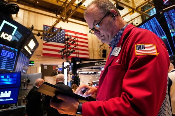 Trader William Lawrence works on the floor of the New York Stock Exchange, Wednesday, May 14, 2025. (AP Photo/Richard Drew)