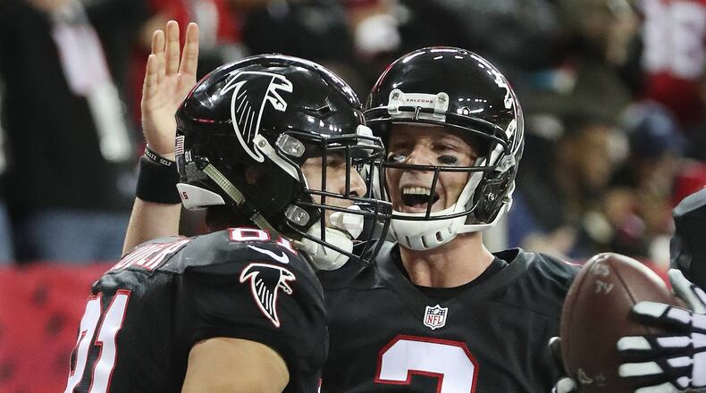 Falcons quarterback Matt Ryan celebrates his touchdown pass to tight end Austin Hooper for a 21-0 lead over the 49ers during the first quarter in NFL football game on Sunday, Dec. 18, 2016, in Atlanta. Curtis Compton/ccompton@ajc.com