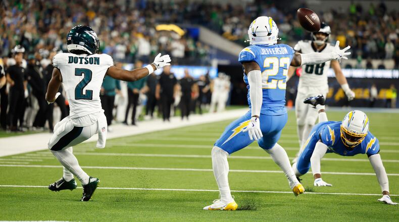 Los Angeles Chargers safety Tony Jefferson (23) intercepts a pass intended for Philadelphia Eagles wide receiver Jahan Dotson (2) during overtime of an NFL football game Monday, Dec. 8, 2025, in Inglewood, Calif. (AP Photo/Caroline Brehman)