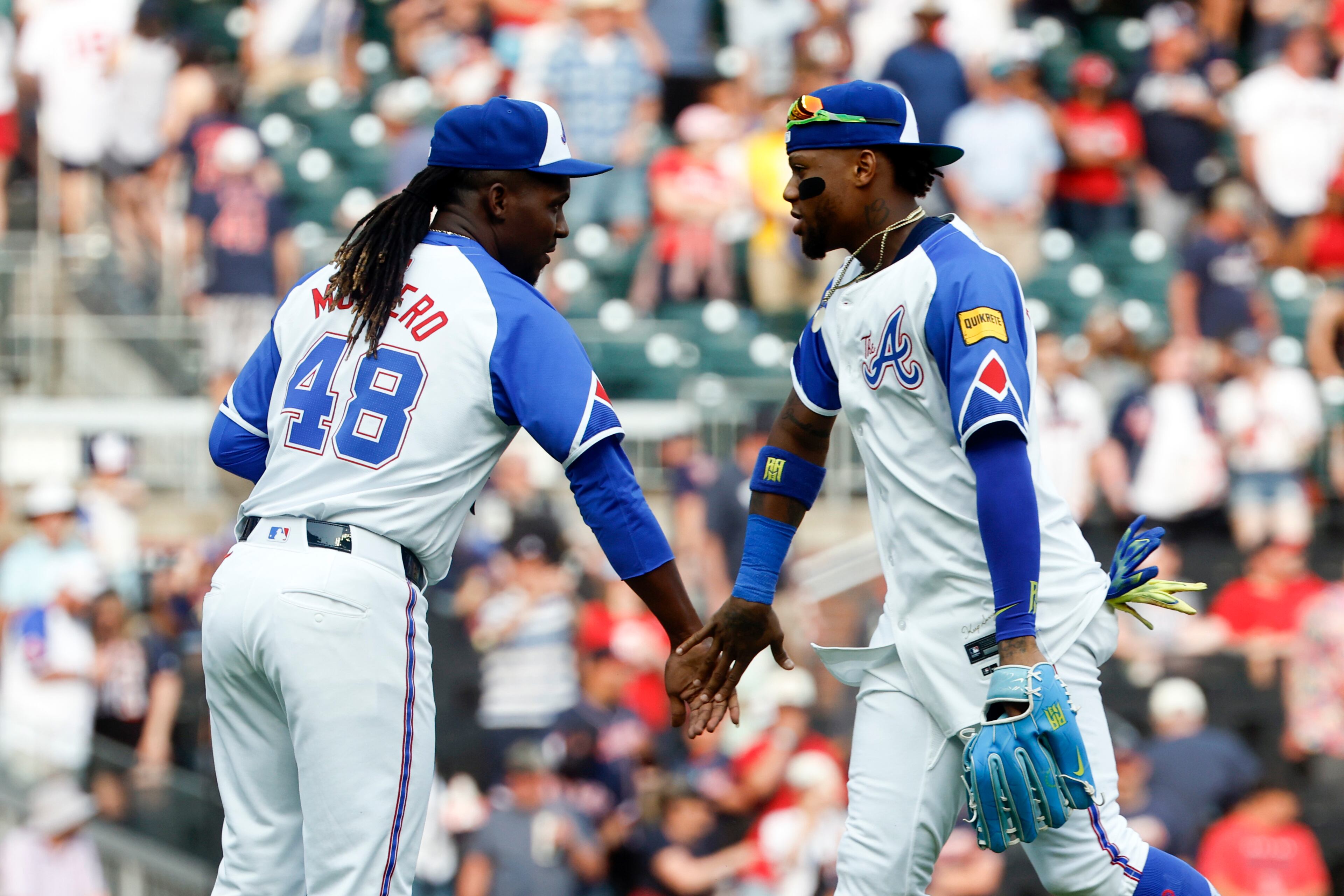 Atlanta Braves pitcher Rafael Montero (48) and Ronald Acuña Jr., right, celebrate after their win over the Boston Red Sox in a baseball game, Saturday, May 31, 2025, in Atlanta. (AP Photo/Butch Dill)