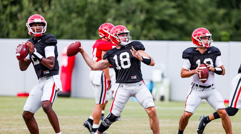 Georgia quarterback D'Wan Mathis (2), Georgia quarterback JT Daniels (18), Georgia quarterback Stetson Bennett (13) during the Bulldogs’ practice session in Athens, Ga., on Monday, Sept. 21, 2020. (Photo by Tony Walsh)