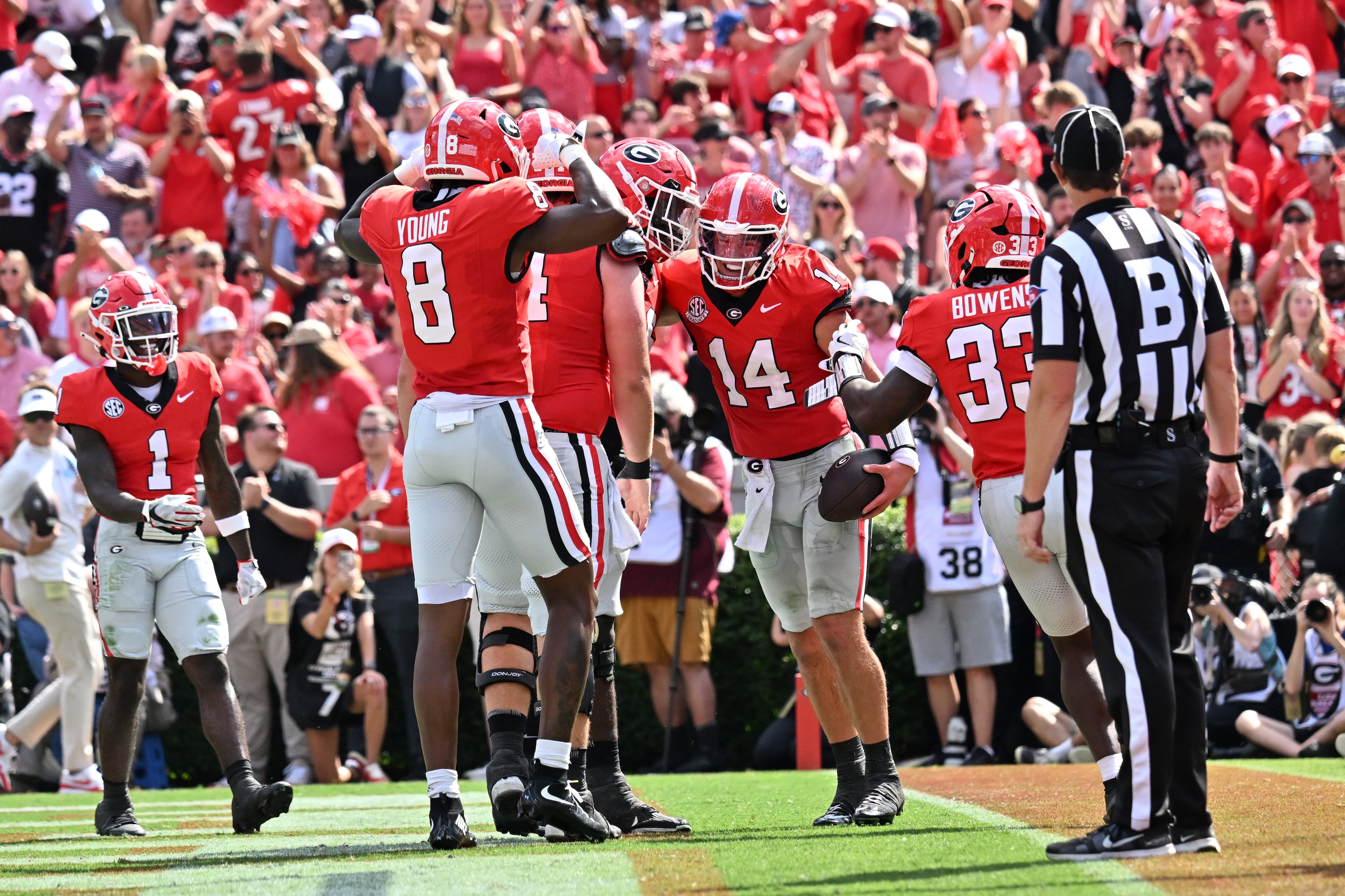 Georgia quarterback Gunner Stockton (14) celebrates with teammates after scoring a touchdown during the first half in an NCAA football game at Sanford Stadium, Saturday, August 30, 2025, in Athens. (Hyosub Shin / AJC)
