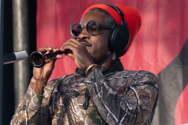 André 3000 plays flute onstage at the Atlanta Jazz Festival in May. Courtesy of John Stephens