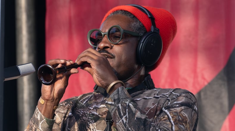 Andre 3000 plays flute onstage at the Atlanta Jazz Festival on May 27, 2024.
