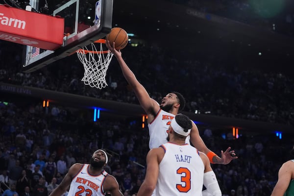 New York Knicks' Karl-Anthony Towns (32) drives to the basket during the first half of Game 6 in the Eastern Conference semifinals of the NBA basketball playoffs against the Boston Celtics Friday, May 16, 2025, in New York. (AP Photo/Frank Franklin II)