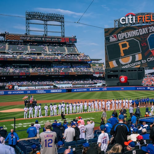 Players line up for introductions during an opening-day baseball game between the New York Mets and the Pittsburgh Pirates, Thursday, March 26, 2026, in New York. (AP Photo/Angelina Katsanis)