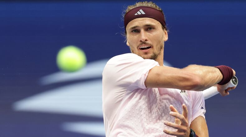 Alexander Zverev, of Germany, returns the ball to Ben Shelton, of the United States, during the men's singles final of the U.S. Open tennis championships Sunday, Sept. 13, 2026, in New York. (AP Photo/Adam Hunger)