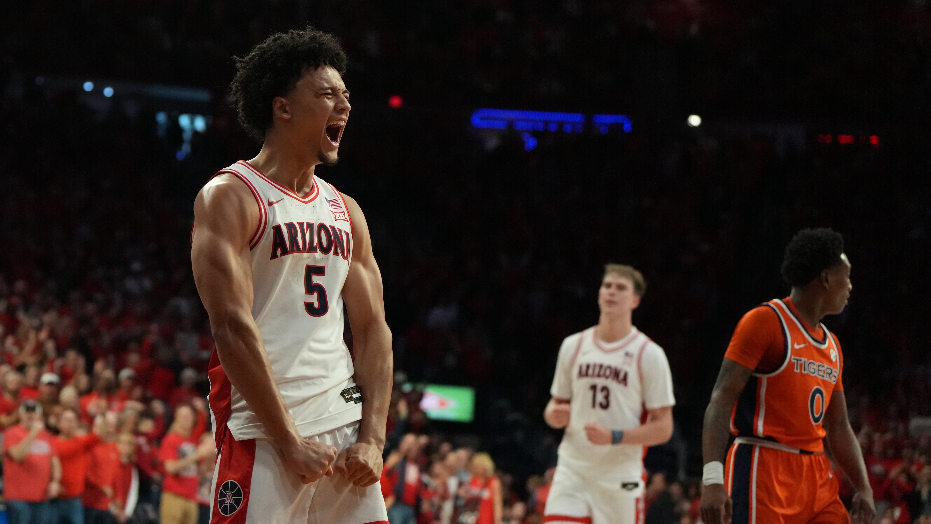 Arizona guard Brayden Burries (5) reacts after scoring against Auburn during the second half of an NCAA college basketball game, Saturday, Dec. 6, 2025, in Tucson, Ariz. (AP Photo/Rick Scuteri)