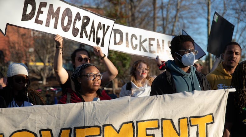 Protesters with the People's Movement Assembly gather outside of Atlanta Mayor Andre Dickens reelection part on March 11, 2025 demanding that the city count signatures submitted as part of the public safety training center referendum. (Riley Bunch/riley.bunch@ajc.com