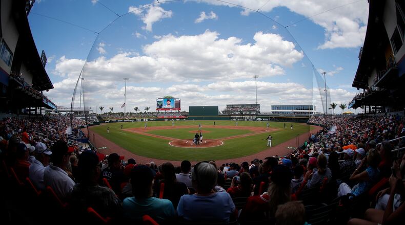 Fans watch as the Tampa Bay Rays and Atlanta Braves meet in a spring training baseball game Sunday, March 24, 2019, in North Port, Fla. The game was the first played in the Braves' new spring stadium, CoolToday Park.