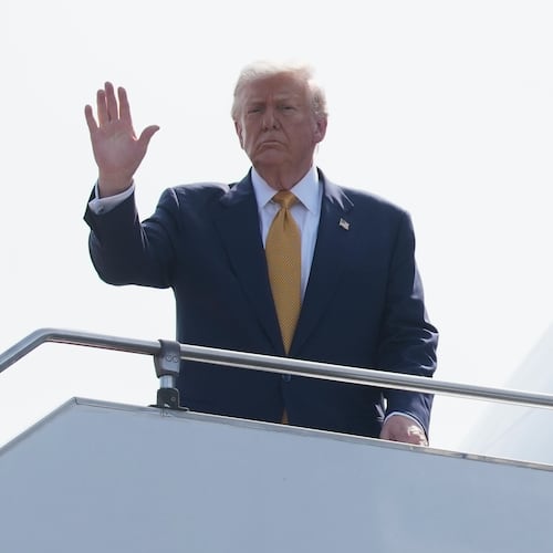 President Donald Trump waves as he boards Air Force One at Kuala Lumpur International Airport in Sepang, Malaysia, as he departs for Japan, Monday, Oct. 27, 2025. (AP Photo/Mark Schiefelbein)