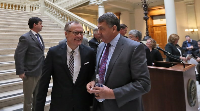 Lt. Governor Casey Cagle (center ), walks with Senator Steve Gooch. BOB ANDRES /BANDRES@AJC.COM