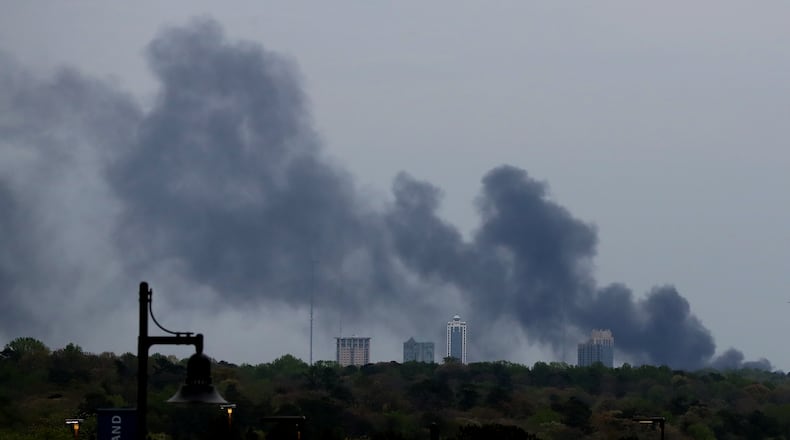 Smoke fills the sky over midtown Atlanta from a bridge fire and collapse at I-85 on Thursday. Curtis Compton, ccompton@ajc.com