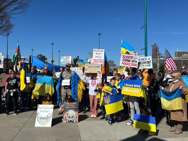 Protesters condemned Trump's rhetoric at the Oval Office meeting with Zelenskyy. (Ashley Ahn for AJC)