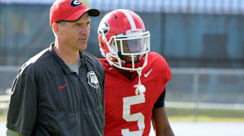 Georgia assistant coach John Lilly and receiver Terry Godwin (5) during the Bulldogs' practice at North Florida's Hodges Stadium on Monday, Dec. 28, 2015, in Jacksonville, Fla.