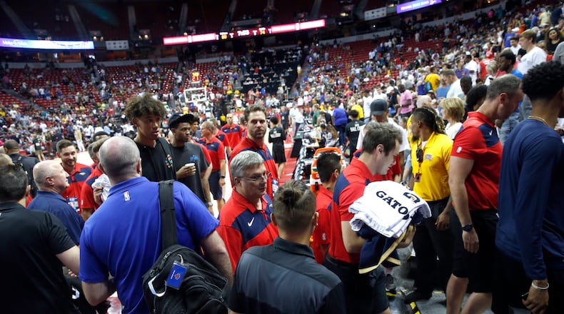 Players and staff leave the court after an earthquake during an NBA summer league basketball game between the New York Knicks and the New Orleans Pelicans on Friday, July 5, 2019, in Las Vegas. (AP Photo/Steve Marcus)