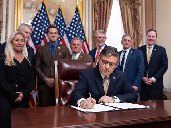 House Speaker Mike Johnson, R-La., puts his signature on the Laken Riley Act, with members of the Georgia congressional delegation attending, at the Capitol in Washington, D.C., on Thursday, Jan. 23, 2025. (J. Scott Applewhite/AP)