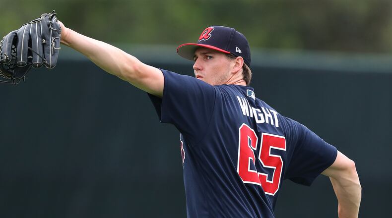Pitcher Kyle Wright loosens up during Monday's workout. (Curtis Compton/ccompton@ajc.com)