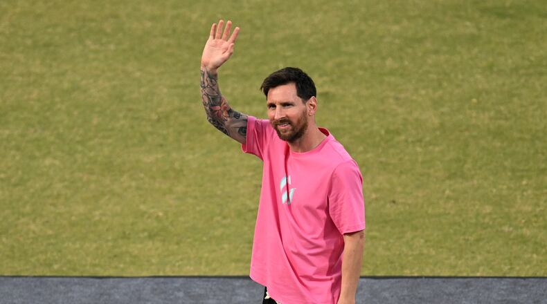 Argentinia's soccer star Lionel Messi waves to fans during his India tour in New Delhi, India, Monday, Dec. 15, 2025. (AP Photo)